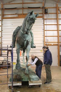The horse in our shop with senior sculpture conservator Tom Podnar and Dr. Battocchi (blue jacket).
